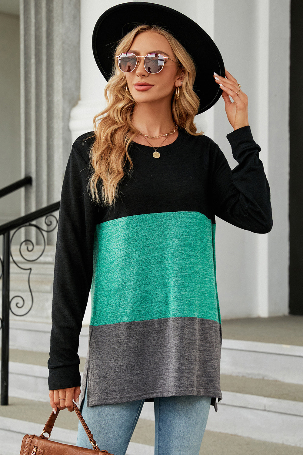 Colorblock long sleeve tee in black, teal, and charcoal with a slit hem.