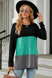 Colorblock long sleeve tee in black, teal, and charcoal with a slit hem.