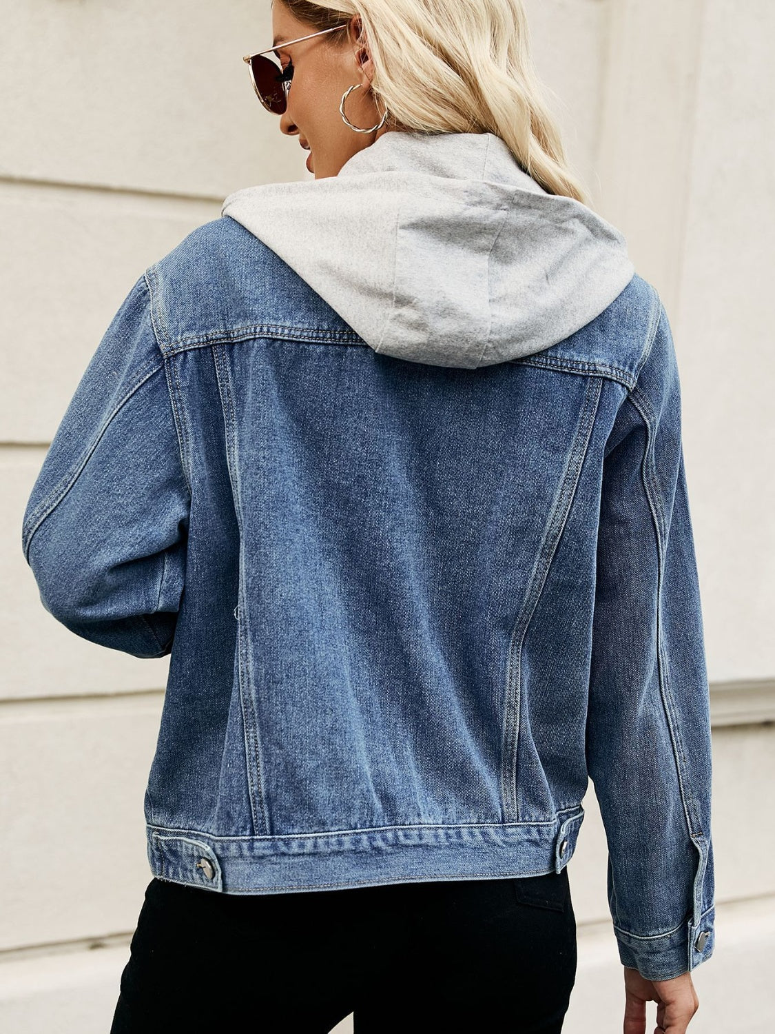 Denim jacket with contrast grey hood, button front, and classic collar.