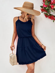 Dark blue camisole mini dress with tiered ruffles and spaghetti straps.