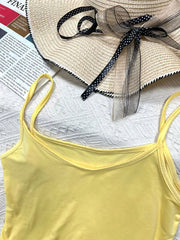 Yellow scoop neck cami with thin straps, part of a set.