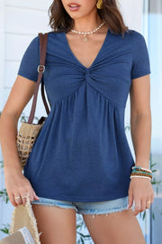 Blue polyester short-sleeve blouse with V-neck and twist knot detail.