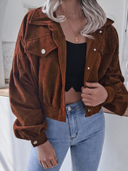 Brown corduroy cropped jacket with balloon sleeves and button-up front.