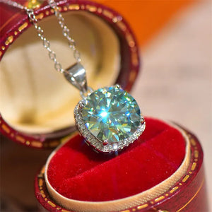 Silver cushion-cut moissanite halo pendant necklace with a dazzling center stone.