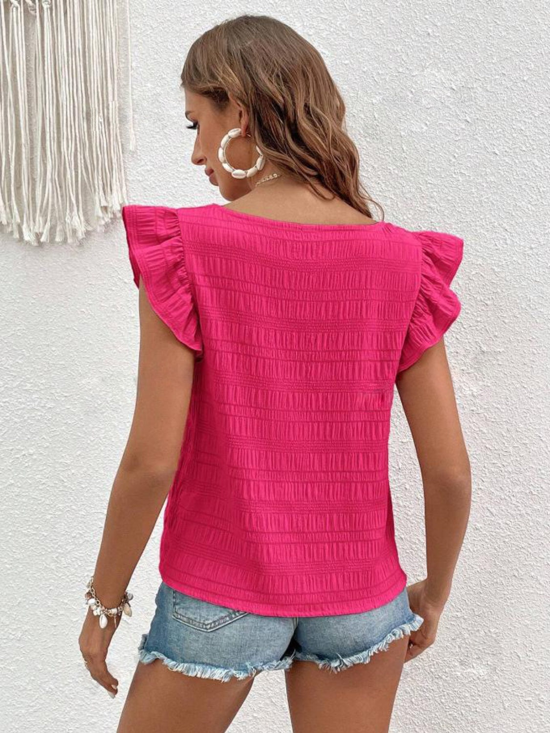 Textured ruffle sleeve square neck top in hot pink with a textured pattern.
