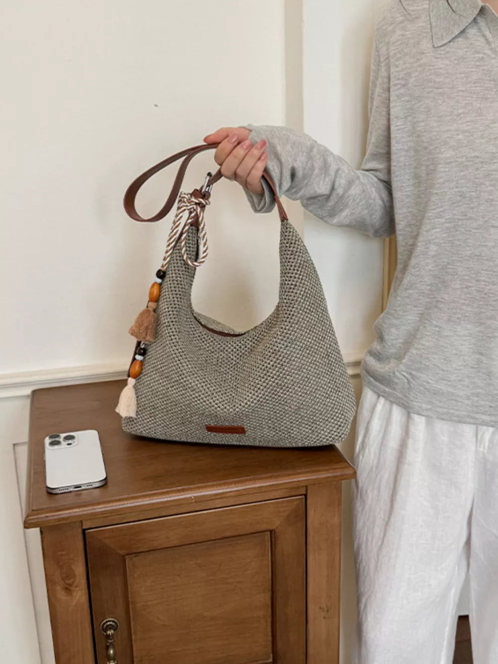 Tassel Woven Shoulder Bag in Sky Blue, side view
