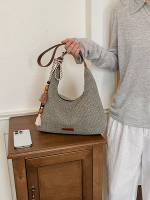 Tassel Woven Shoulder Bag in Sky Blue, side view