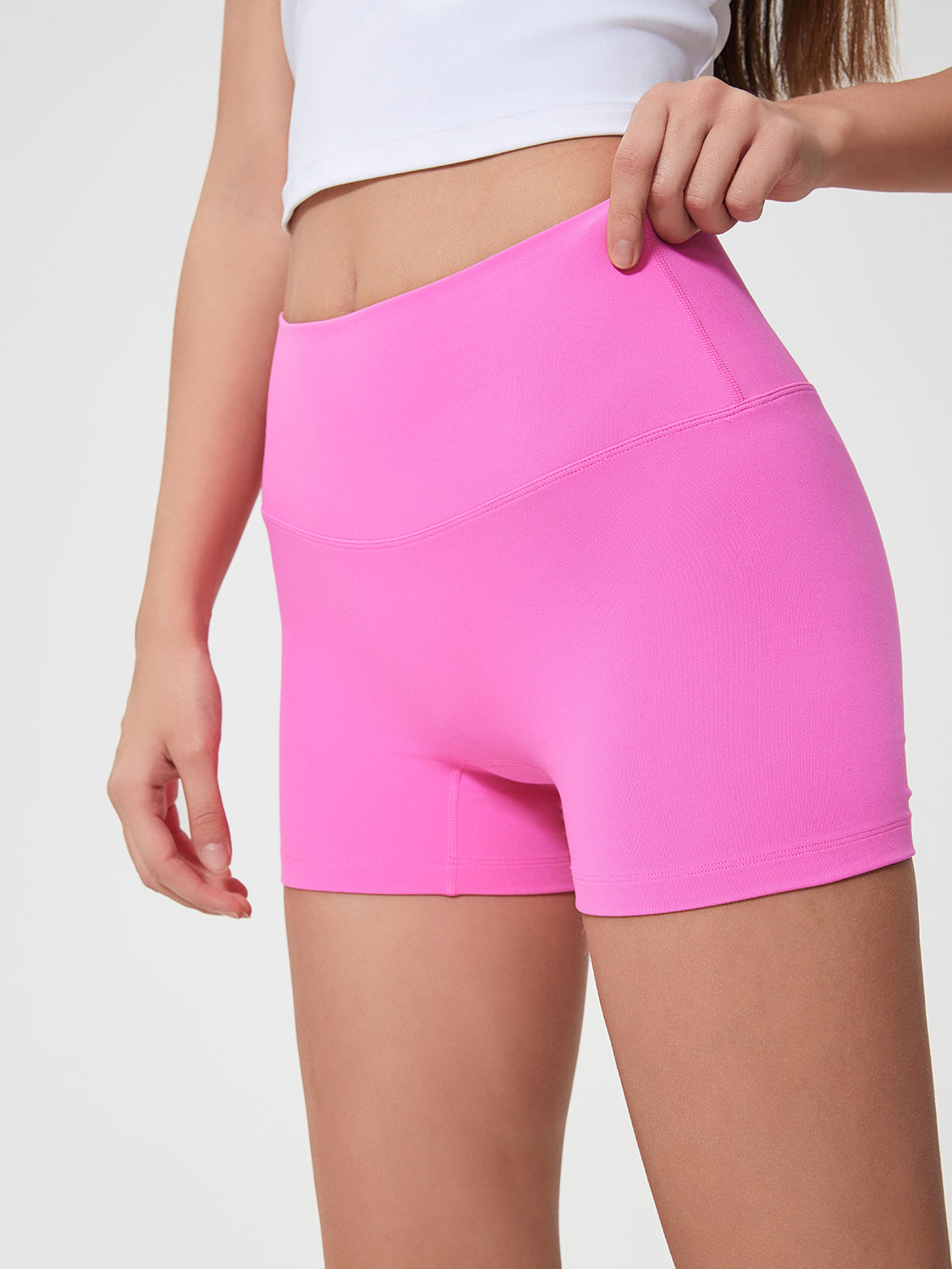 Nova Rise High-Motion Shorts in Fuchsia Pink with a seamless high waist and fitted cut.
