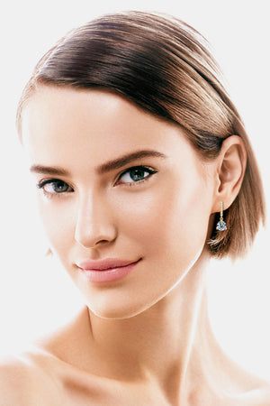 Gold drop earrings with clear prism charm and diamond accents.