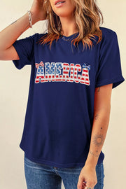 Navy patriotic graphic t-shirt with "AMERICA" text and bow details, short sleeves, relaxed fit.