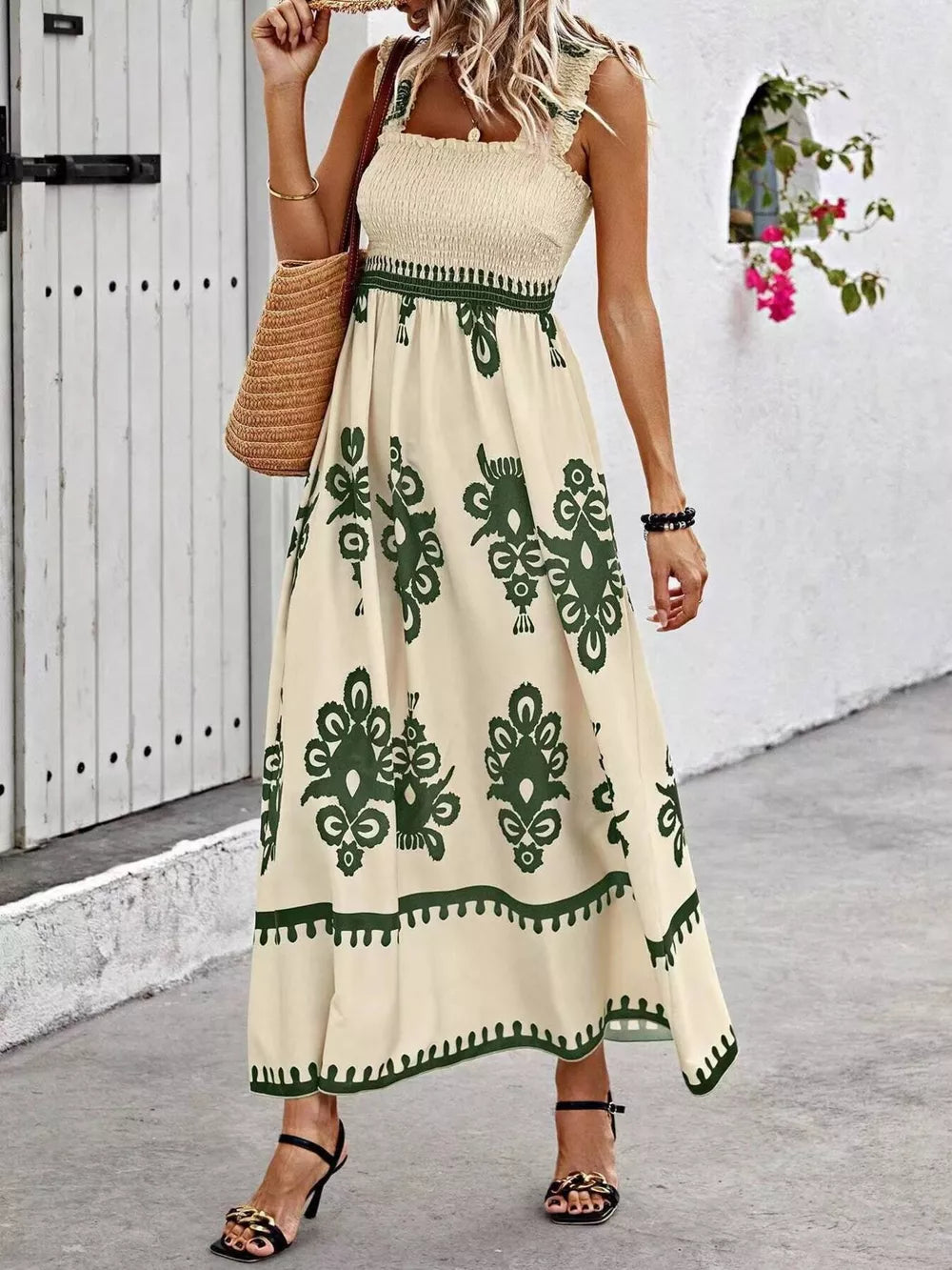 Smocked square neck maxi dress in tan with dark green paisley print and a-line cut.