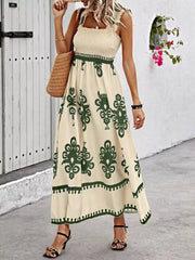Smocked square neck maxi dress in tan with dark green paisley print and a-line cut.