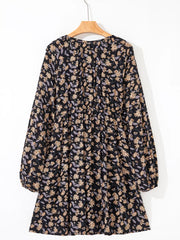 Babydoll dress with dark floral print, bubble sleeves, and gathered waist.