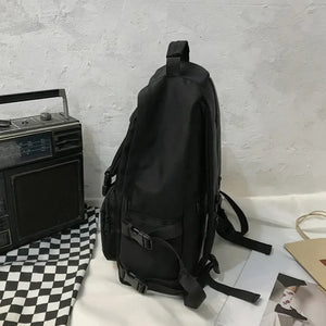 Black utility buckle backpack with multiple pockets and adjustable straps.
