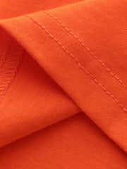 Orange cotton toddler t-shirt with crew neck and short sleeves, showing stitched hem detail.