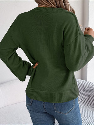 Army green acrylic cable knit button-front cardigan with crew neck and long sleeves.