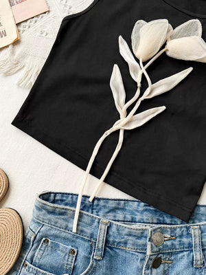 Black tank top with floral applique detail and round neck.
