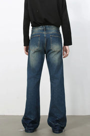 Faded wash dark flare jeans with a casual, bootcut style.