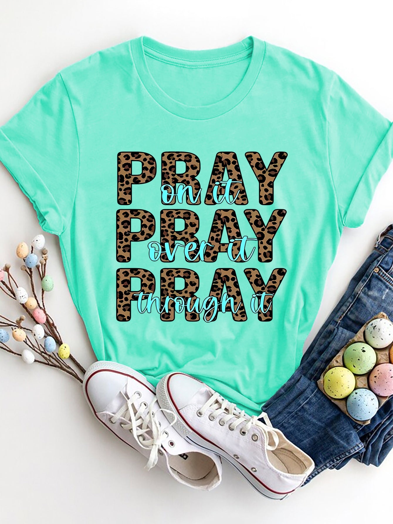 Aqua graphic tee with leopard print text saying Pray on it Pray over it Pray through it