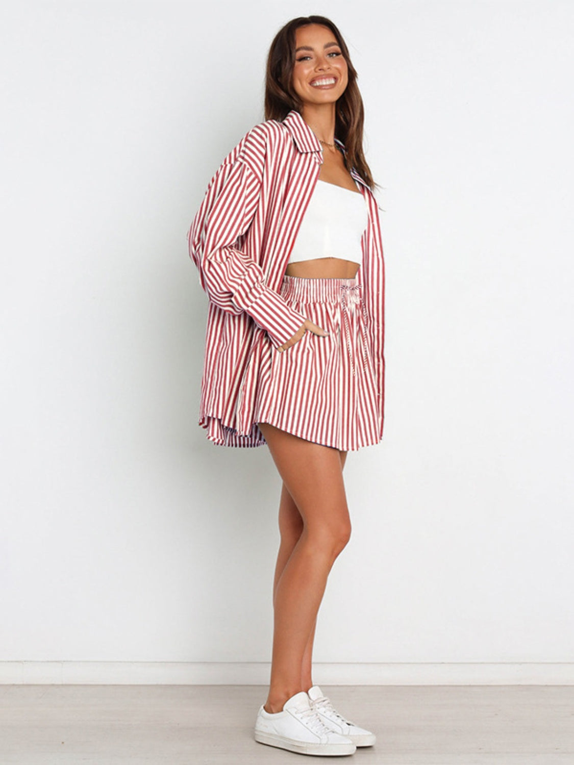 Oversized red and white stripe shirting set with button-up shirt and drawstring shorts.