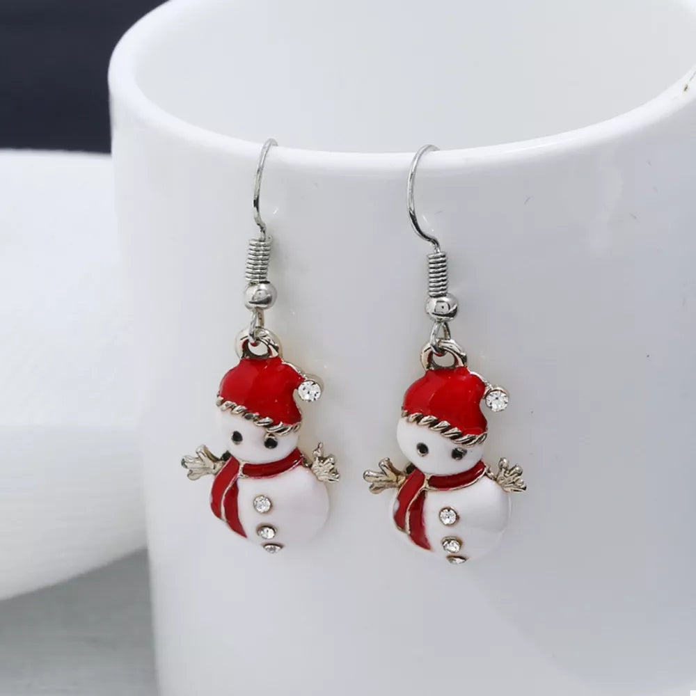 Festive snowman drop earrings with red hats and scarves, featuring crystal accents.