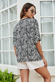 Black and white zebra print boxy tee with short sleeves.