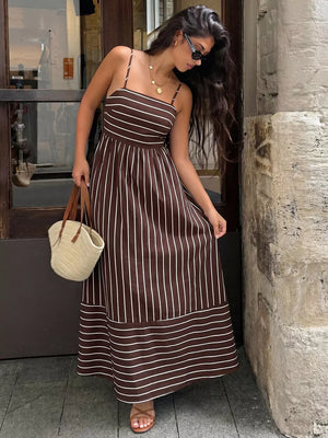 Brown striped maxi dress with smocked detail and cutout, spaghetti straps.
