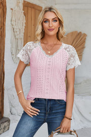 Pink eyelet raglan blouse with white lace short sleeves and V-neck.