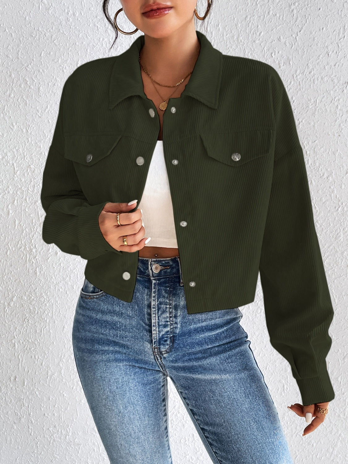 Cropped corduroy jacket in Army Green with snap front and chest pockets.