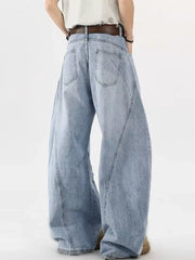 Distressed light blue wide-leg jeans with belt, cotton denim, casual men's style.