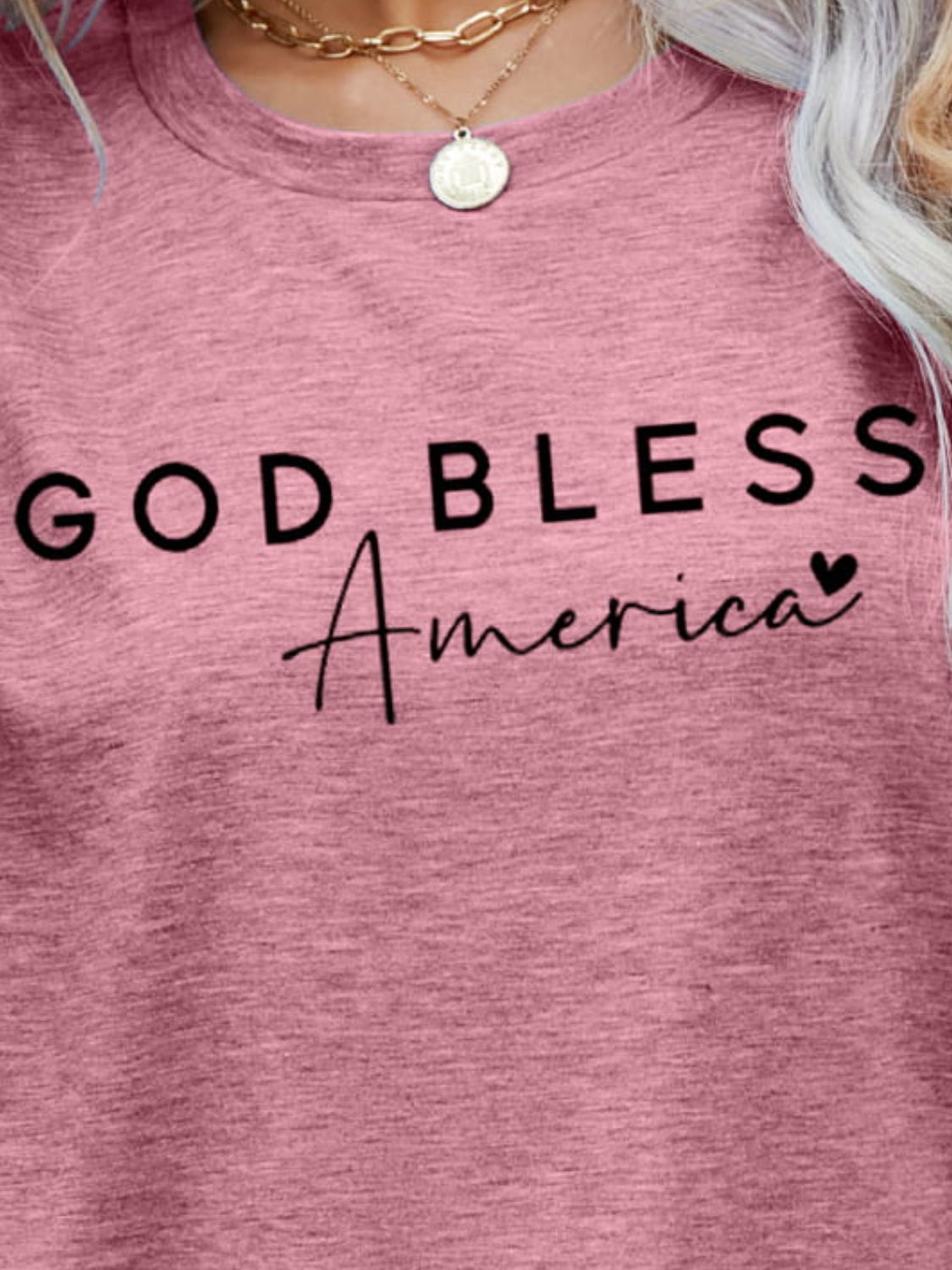 Dusty Pink God Bless America script tee with crew neck.