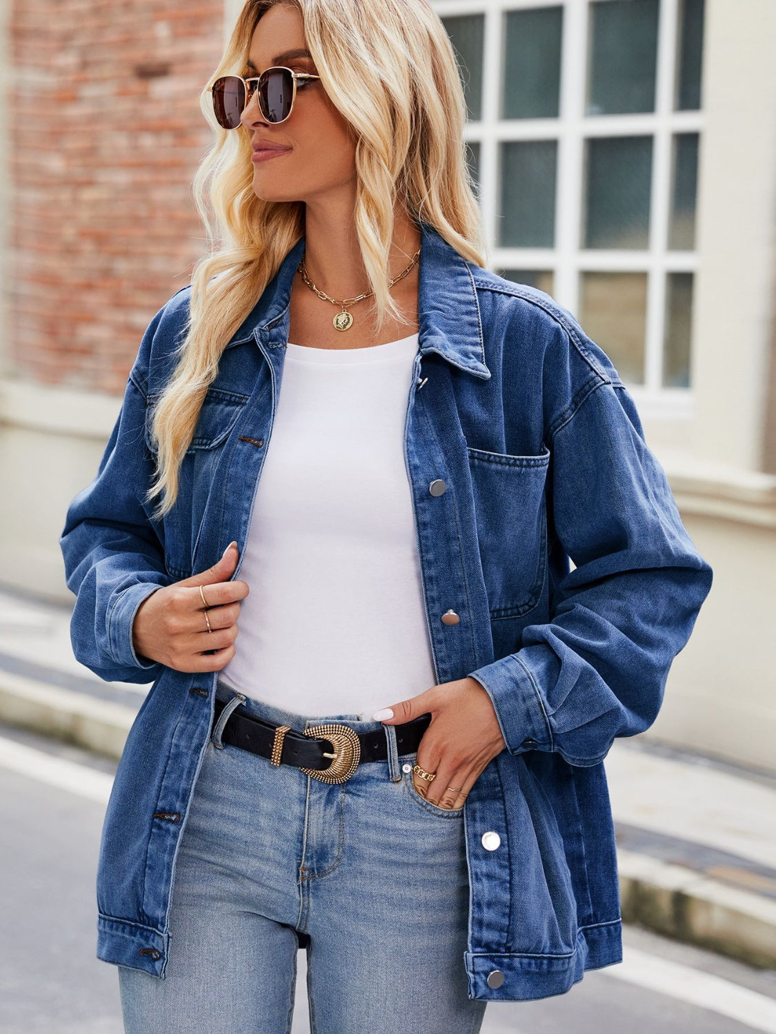 Oversized blue denim shacket with button-down front and chest pockets.