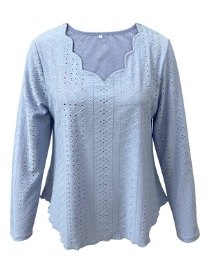 Light blue eyelet blouse with scalloped neckline and long sleeves.