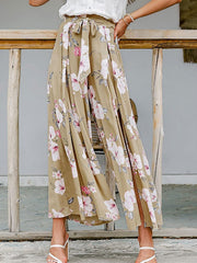 Floral wide-leg palazzo pants with high slits and a tie waist