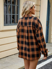 Checkered long sleeve collared top in brown and black plaid.