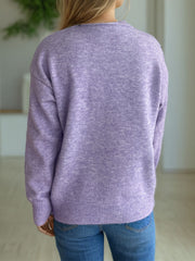 Lavender textured knit crew neck pullover sweater with ribbed hem and cuffs.