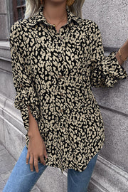 Women's black and beige abstract spot print oversized shirt with button front and rolled sleeves.