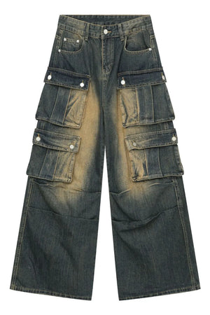 Distressed medium wash denim cargo pants with multiple button-flap pockets and a wide leg.
