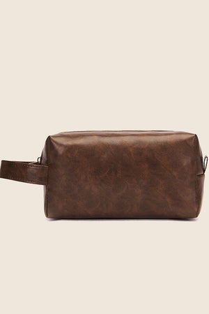 Textured faux leather travel case in caramel with a carry handle