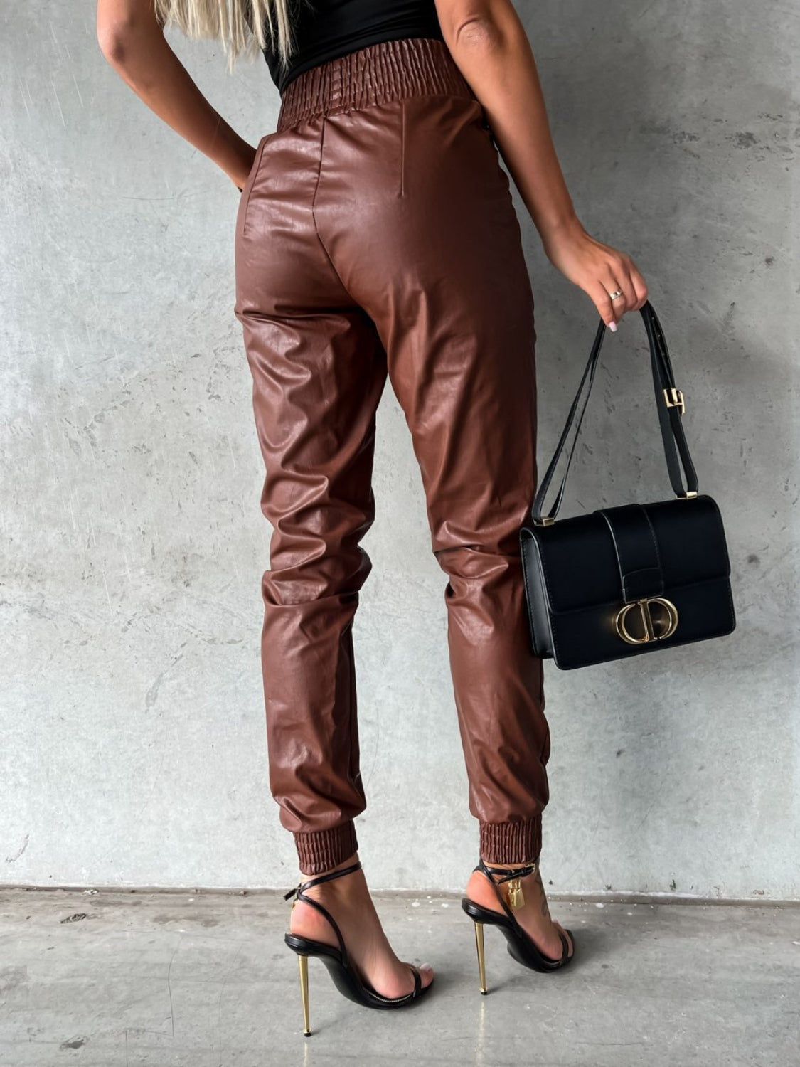Brown leatherette gathered waist joggers with elastic cuffs and cinched ankles.