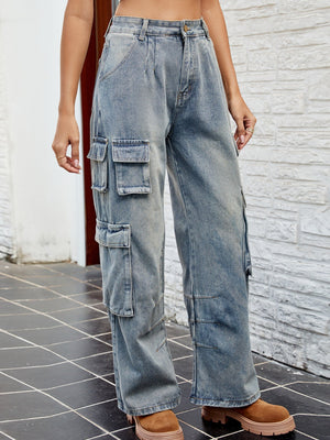 Light wash denim cargo pants with pleated waist and multiple utility pockets.