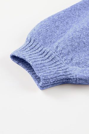 Light blue perforated knit pullover sweater sleeve with ribbed cuff detail.