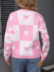 Blush pink and white checkered heart print acrylic cardigan with long sleeves.