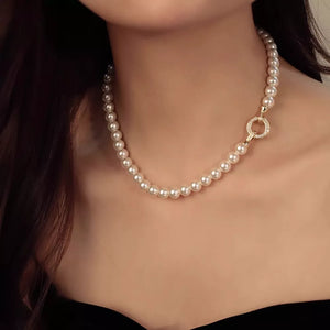 Lustrous pearl choker necklace with 18k gold clasp and crystal accents