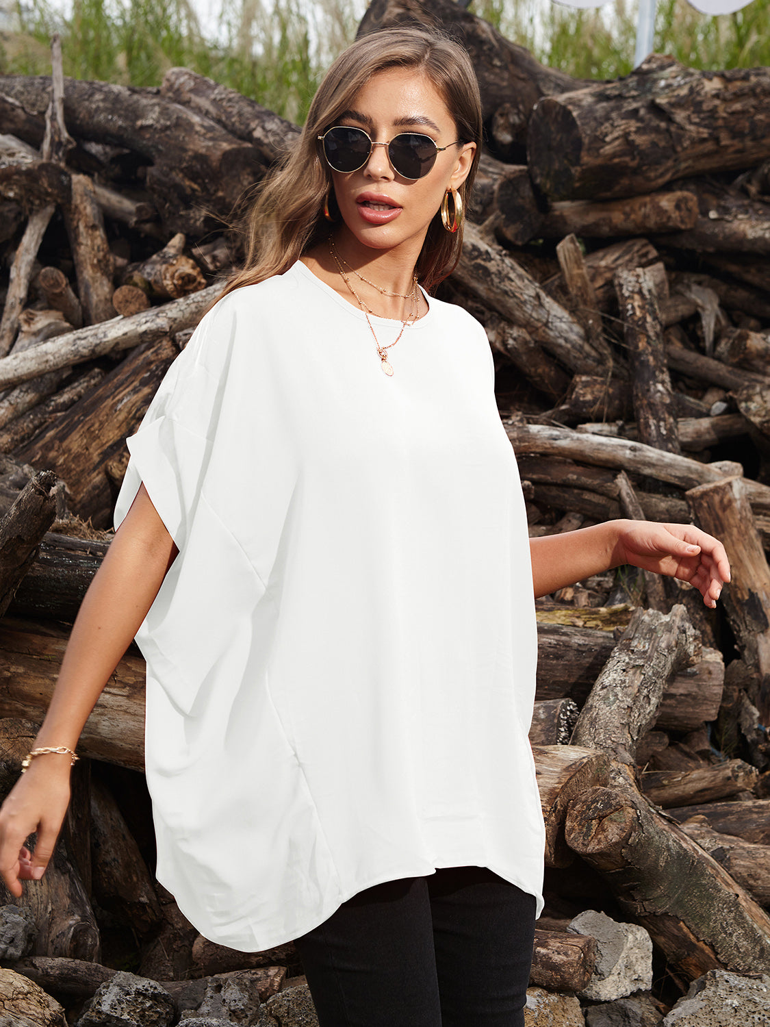 White draped asymmetrical sleeve blouse with a relaxed fit and subtle side slit.