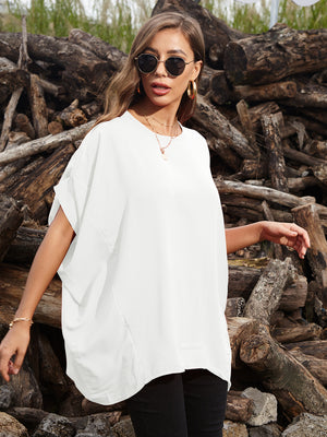 White draped asymmetrical sleeve blouse with a relaxed fit and subtle side slit.