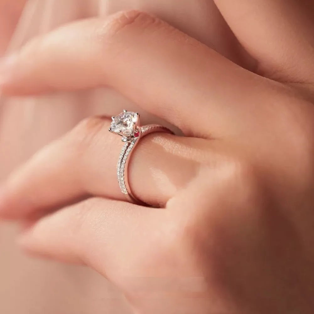 Sterling silver ring with a large moissanite center stone and pave band.