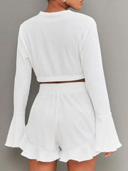White ribbed crop set with flared sleeves and ruffled shorts