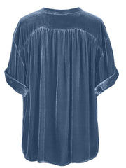 Dusty blue velvet button-down blouse with mandarin collar and cuffed short sleeves.