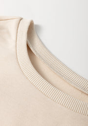 Beige knit tunic top with ribbed neckline detail